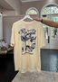 The Clandestine Underground - Cowgirl Beach Club Tee Ivory